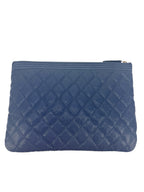 Chanel Blue Caviar Quilted Medium O Case Clutch